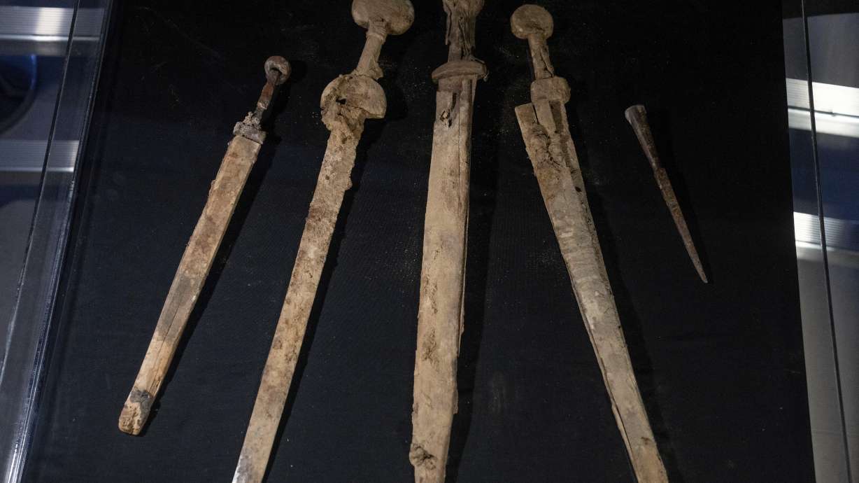 Israeli archaeologists show four Roman-era swords and a javelin head found during a recent excavation in a cave near the Dead Sea, in Jerusalem, Wednesday. Archaeologists said the exceptionally preserved artifacts are dated to the 2nd century.