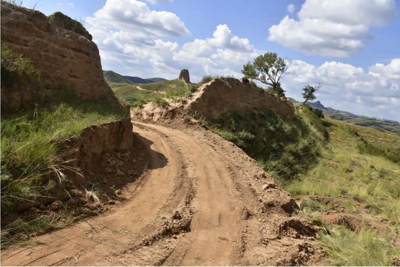 This photo taken from an Aug. 31 online posting by the Youyu police shows what appears to be a path cutting through a section of the ancient Great Wall in Youyu county in northern China's Shanxi province.