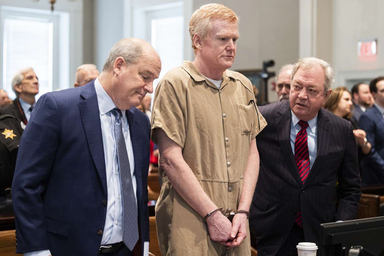 Alex Murdaugh speaks with his legal team before he is sentenced to two consecutive life sentences for the murder of his wife and son by Judge Clifton Newman at the Colleton County Courthouse on March 3 in Walterboro, S.C. Murdaugh's lawyers have filed court papers that he plans to plead guilty in federal court to charges he stole money from clients.