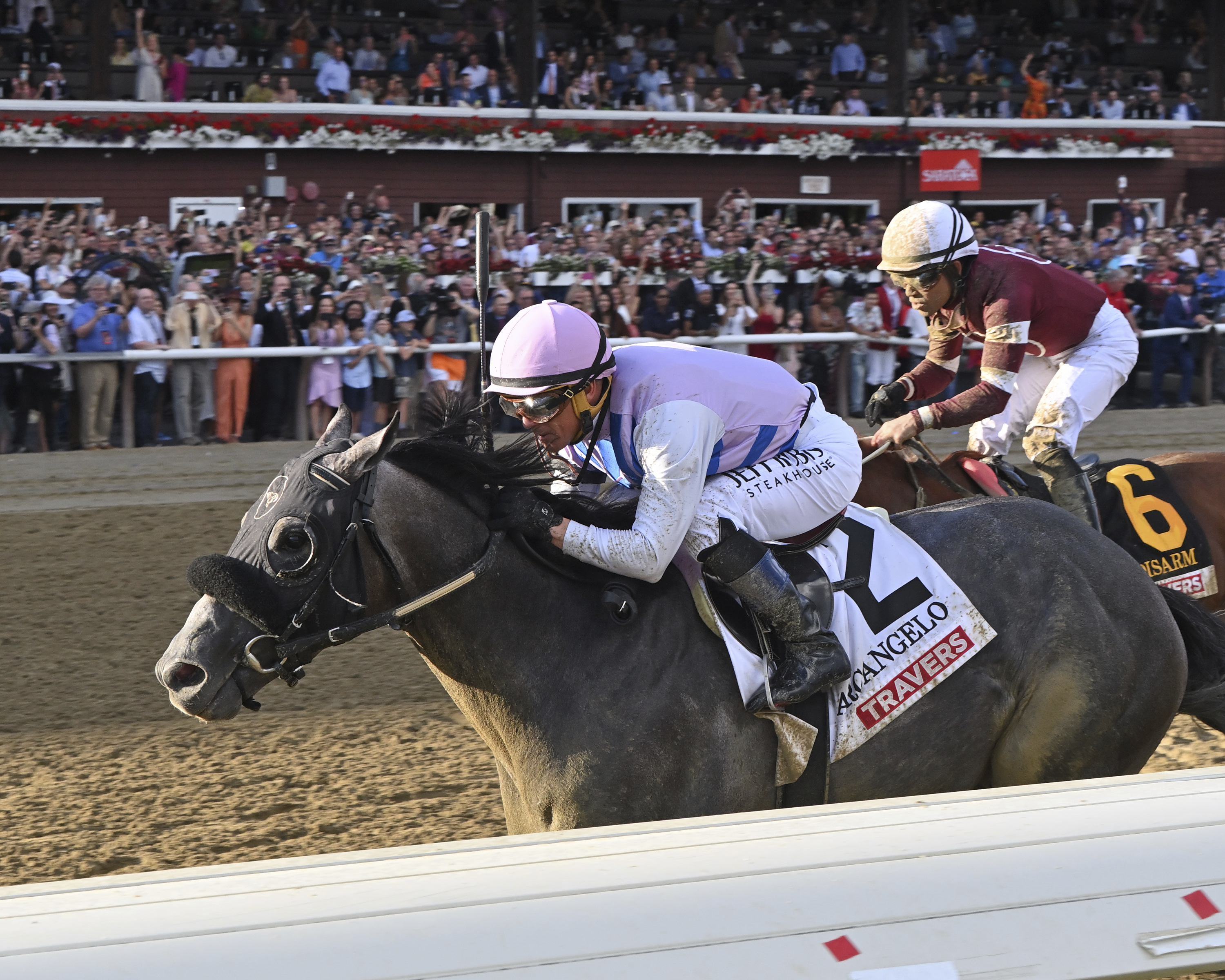 In this photo provided by NYRA, Arcangelo (2), with Javier Castellano aboard, wins the Travers Stakes horse race at Saratoga Race Course in Saratoga Springs, N.Y., Saturday, Aug. 26, 2023.