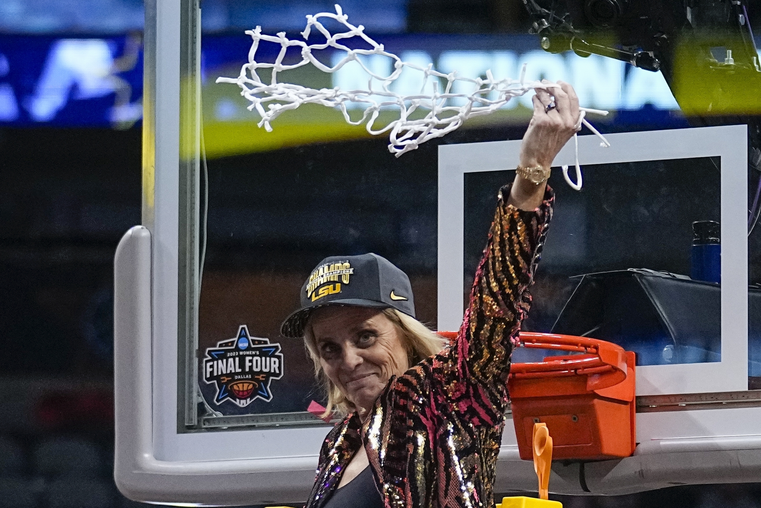 FILE - LSU head coach Kim Mulkey celebrates after cutting down the net after the NCAA Women's Final Four championship basketball game against Iowa, Sunday, April 2, 2023, in Dallas. Mulkey has agreed to a new 10-year contract worth about $32 million that will make her the highest-paid coach in women's college basketball, according to a person with knowledge of the deal.