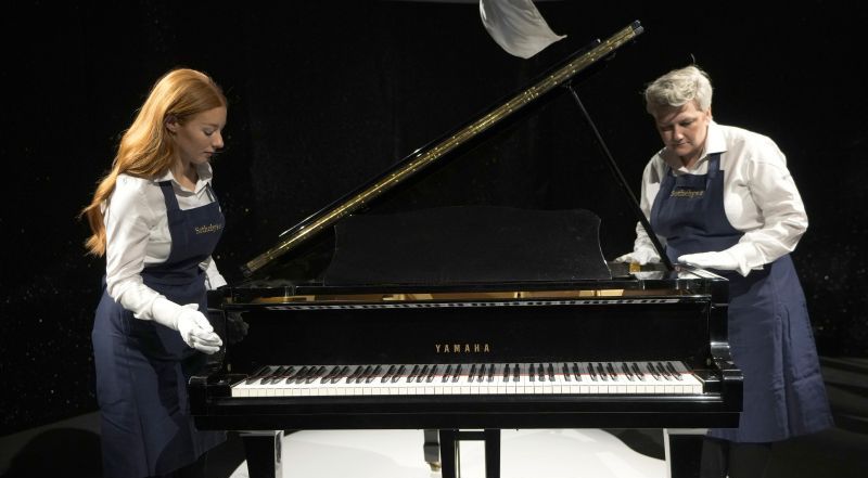 Freddie Mercury's Yamaha Grand Piano, estimated at $2.5 to $3.7 million, on display at Sotheby's auction rooms in London, Thursday. More than 1,000 of Freddie Mercury's personal items were on show in an exhibition at Sotheby's London ahead of their sale.