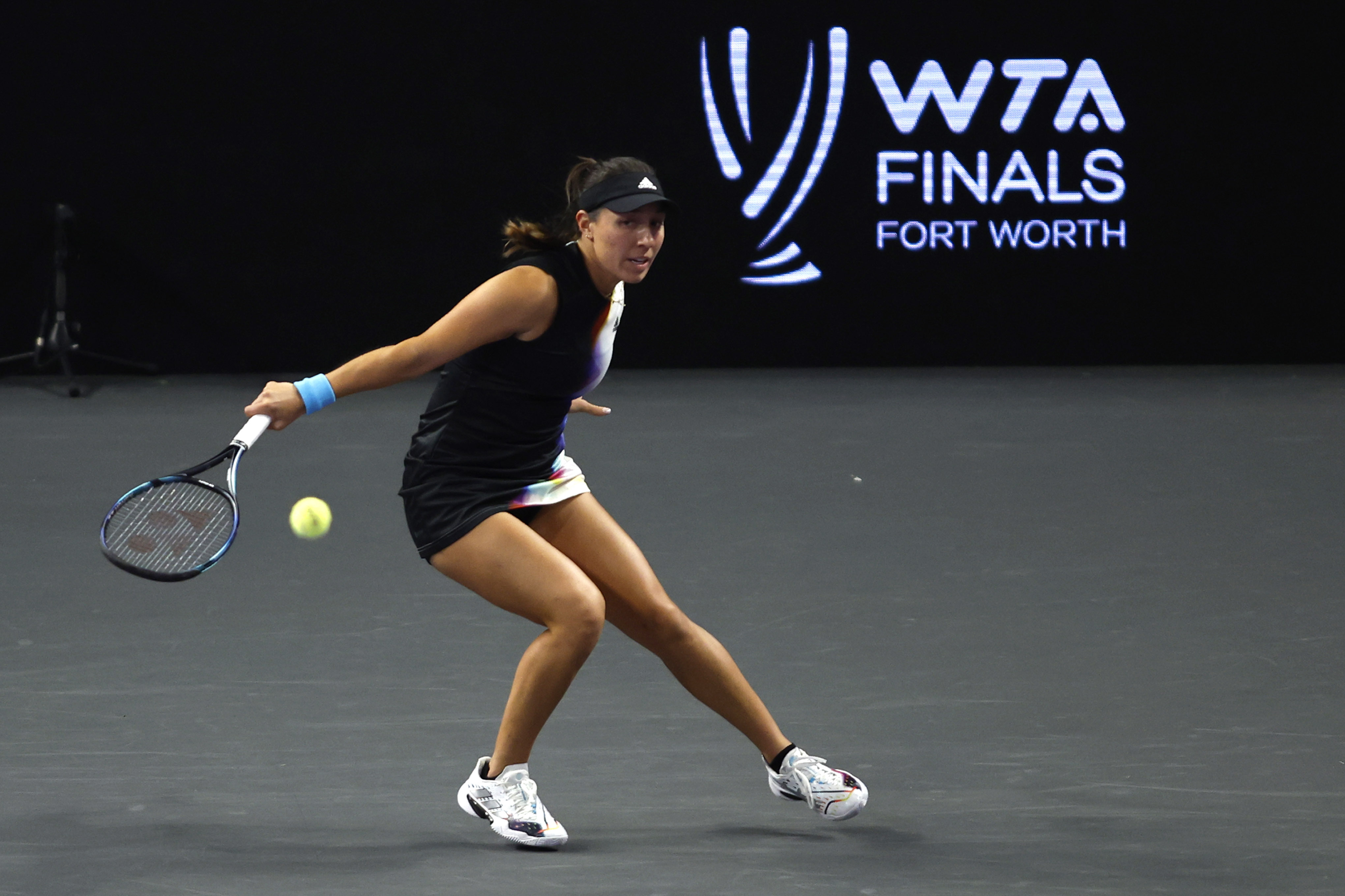 FILE - Jessica Pegula, of the United States, returns a shot to Ons Jabeur, of Tunisia, during round-robin play on day three of the WTA Finals tennis tournament in Fort Worth, Texas, Wednesday, Nov. 2, 2022. The women’s tennis tour will hold the WTA Finals in Cancun, Mexico, from Oct. 29 to Nov. 5, finally finding a site for the season-ending event that has shifted cities repeatedly. 
