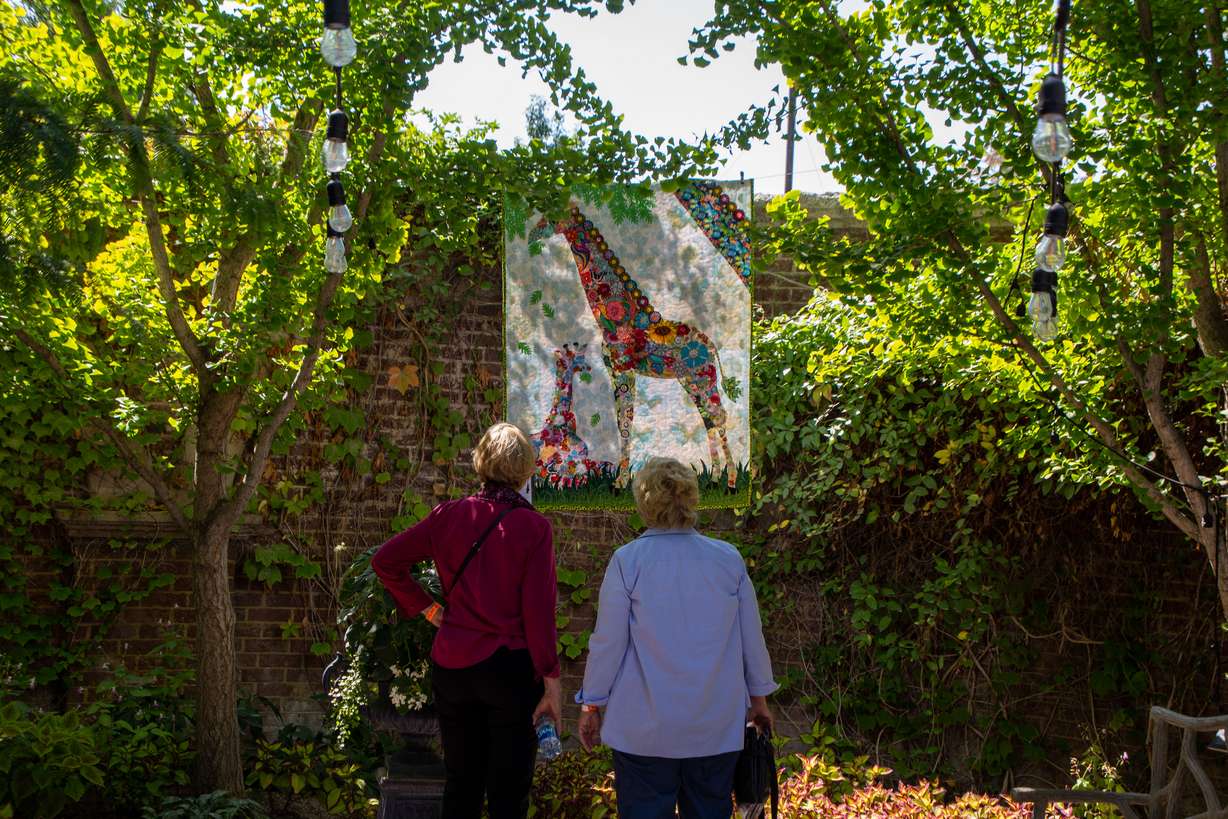 Festival attendees admire a quilt at the Garden of Quilts festival at Thanksgiving Point in Lehi.