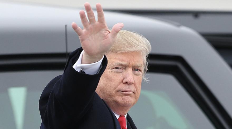 President Donald Trump waves to the crowd at the Salt Lake City International Airport Dec. 4, 2017. A new lawsuit filed in Utah by a long-shot Republican presidential candidate attempts to bar Trump from appearing on the 2024 presidential ballot