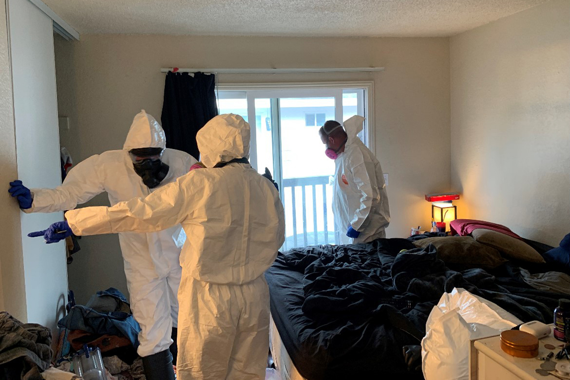 Investigators collect evidence from the home of Evan Frostick and Madison Bernard, the parents of a 15-month-old toddler found unresponsive in a bedroom in Santa Rosa, Calif., on May 9, 2022. They are part of a growing number of parents across the U.S. prosecutors have charged in the fentanyl overdose deaths of their children since the pandemic started.