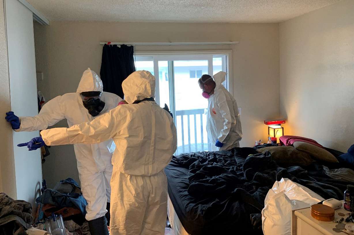 Investigators collect evidence from the home of Evan Frostick and Madison Bernard, the parents of a 15-month-old toddler found unresponsive in a bedroom in Santa Rosa, Calif., on May 9, 2022. They are part of a growing number of parents across the U.S. prosecutors have charged in the fentanyl overdose deaths of their children since the pandemic started.