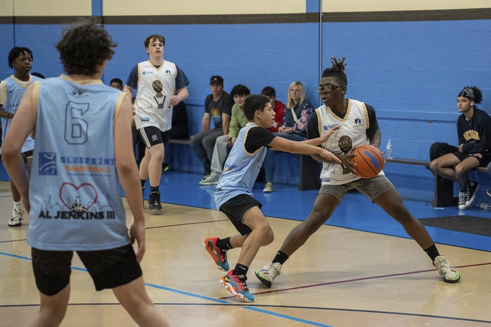 Harris Wolobah, with the basketball in his hands, takes part in game in the Blueprint Basketball League in Worcester, Mass., April 21. Wolobah died Friday, Sept. 1, after his family says he ate an extremely spicy tortilla chip that was sold as the One Chip Challenge.