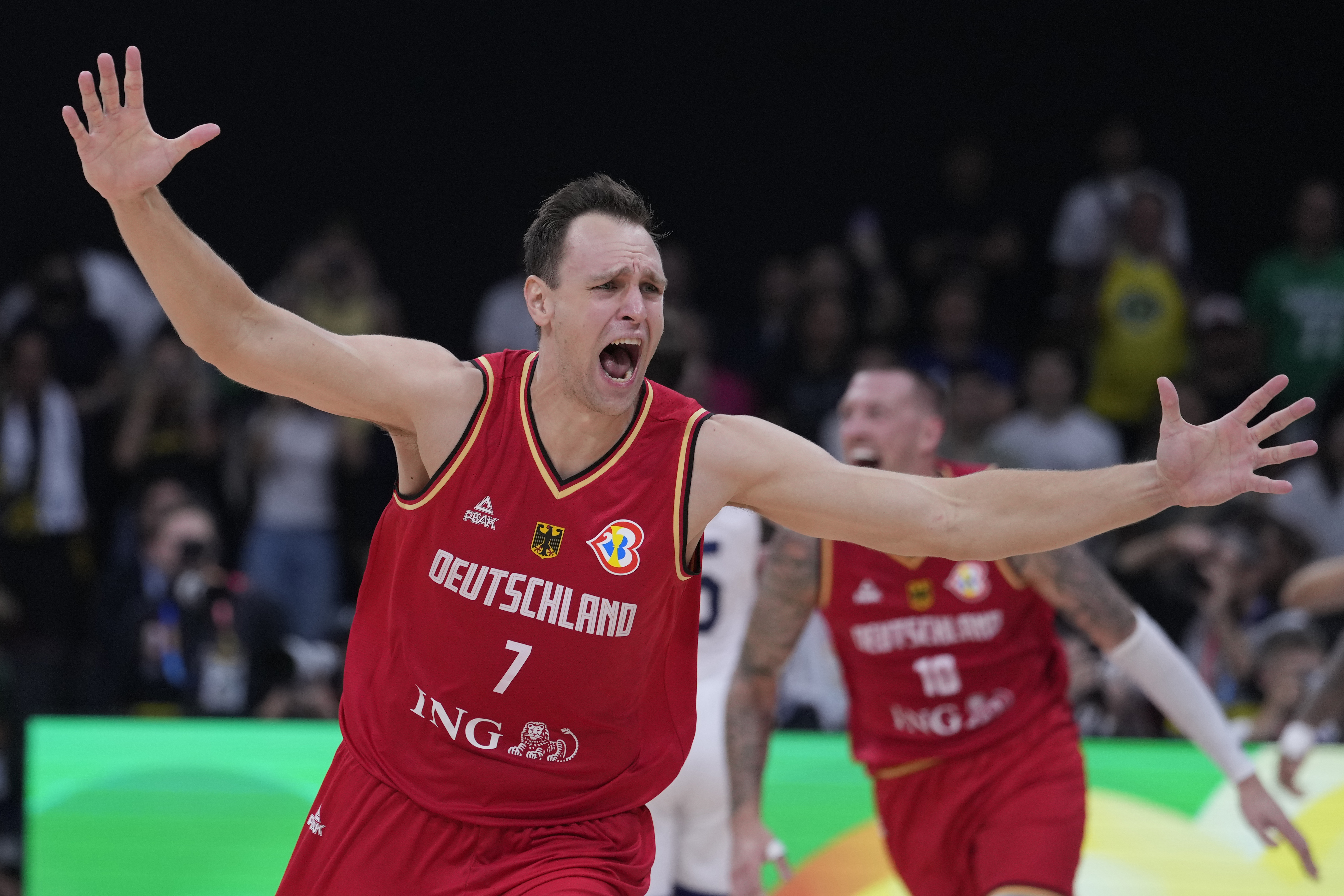 Germany center Johannes Voigtmann celebrates after winning against the United States in a Basketball World Cup semi final game in Manila, Philippines, Friday, Sept. 8, 2023. 