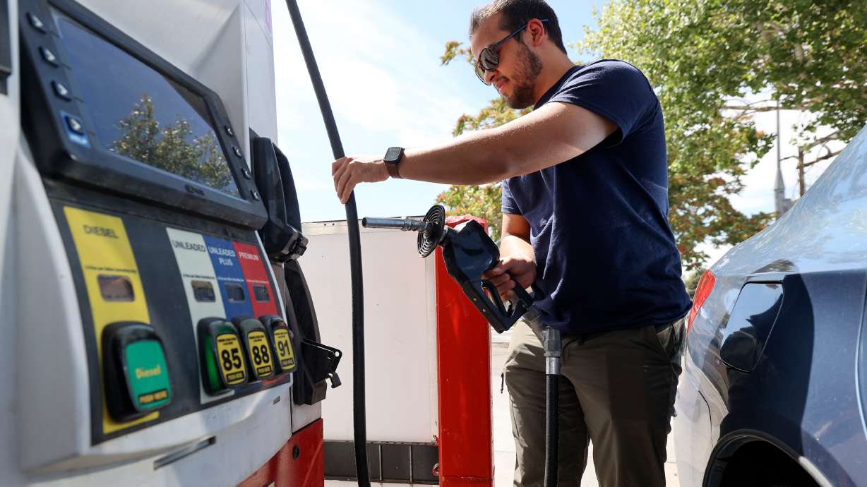 Noah Funtanilla gets gas at Speedway in Salt Lake City on Aug. 7. For the first time since February, Utah's consumer sentiment fell significantly in August.
