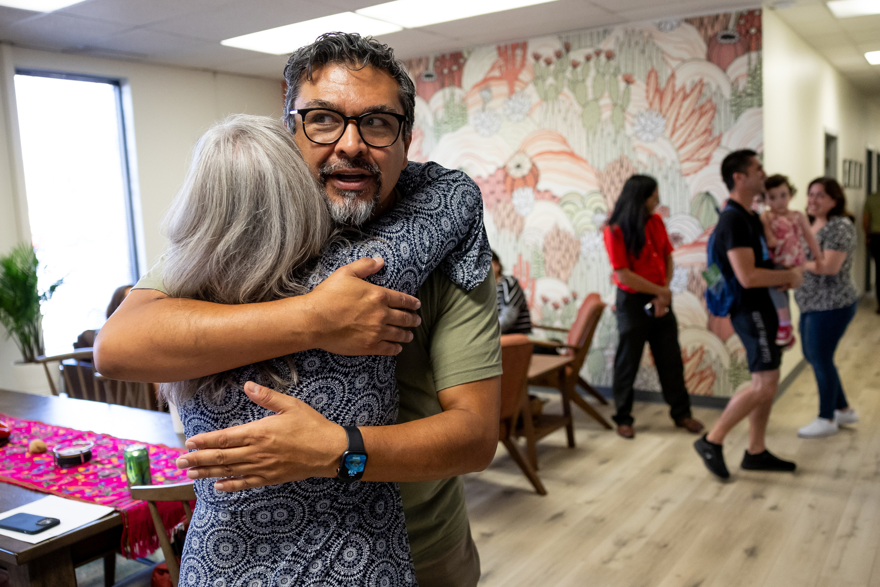 Javier Alegre, executive director of Latino Behavioral Health Services, hugs Katherine Fife, associate deputy mayor of Salt Lake County, at an opening ceremony for the organization’s new facility in South Salt Lake on Thursday.