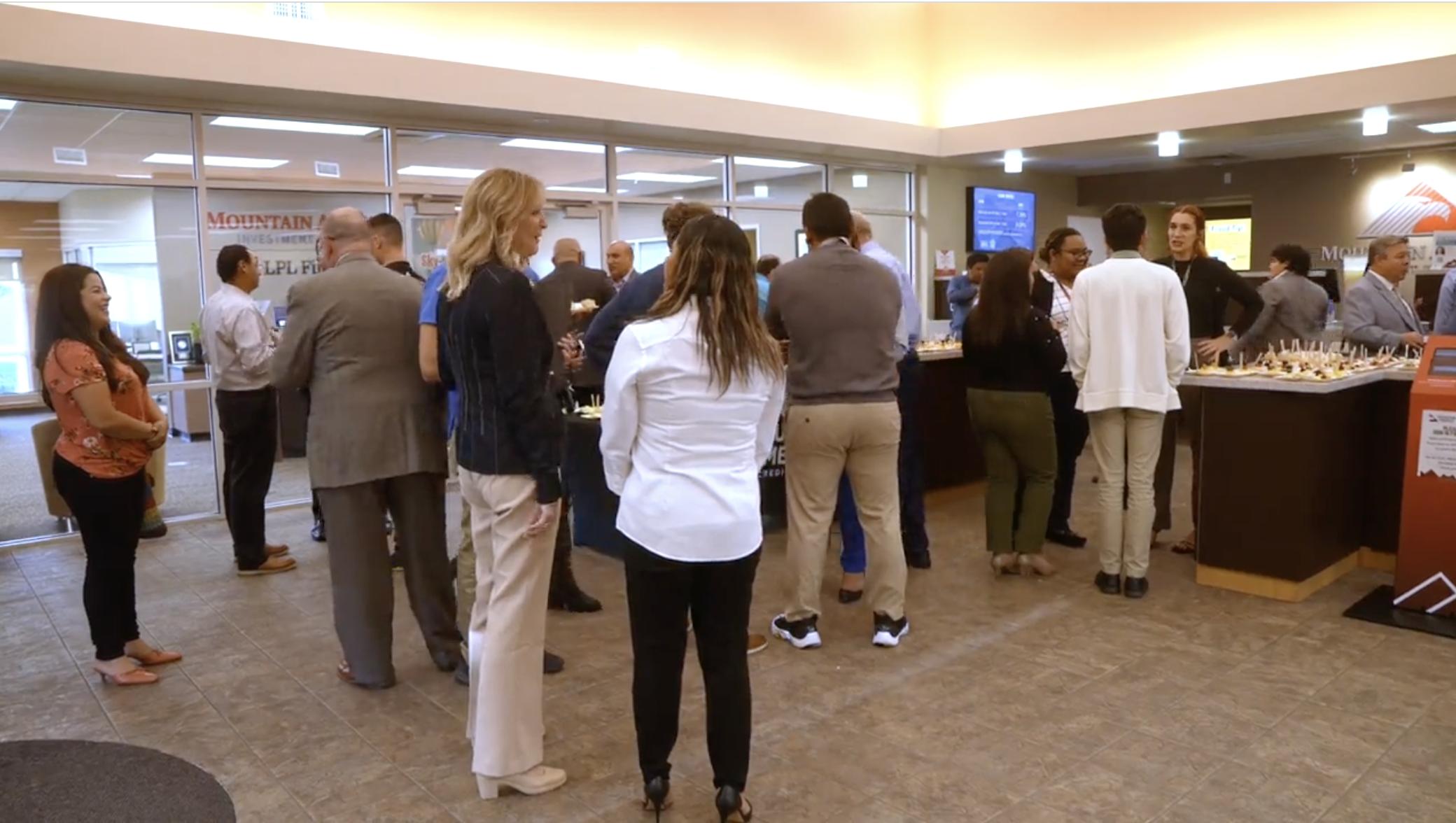 People attend an open house for the Utah Hispanic Chamber of Commerce's new office in Taylorsville on Wednesday.