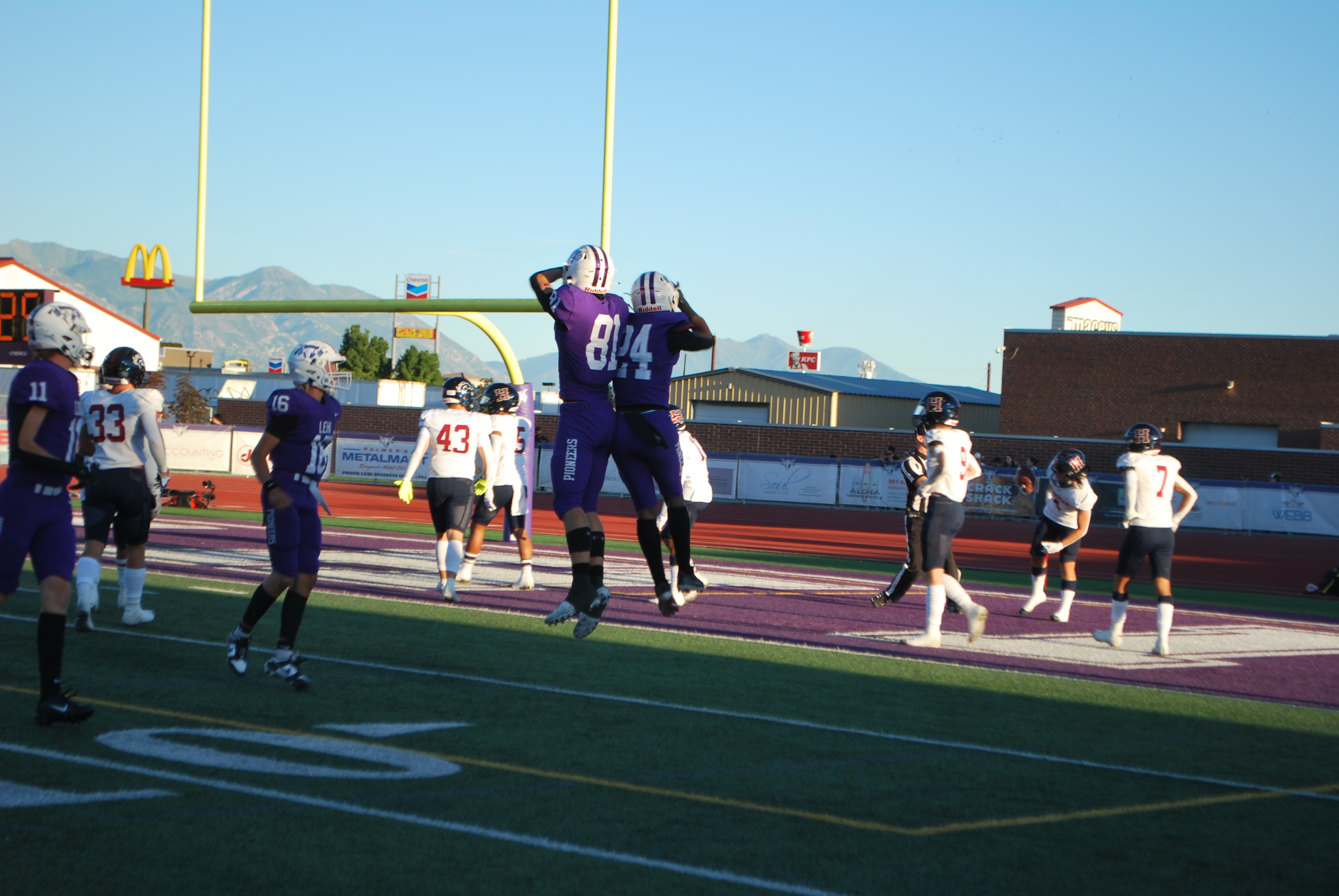 No. 24 Devaughn Eka celebrates after a 52-yard touchdown for the Lehi Pioneers, resulting in a 48-28 win over Herriman on Sept. 9, 2023.