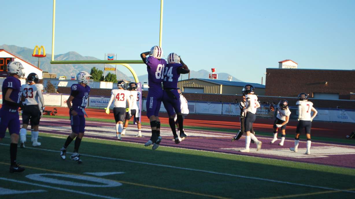 No. 24 Devaughn Eka celebrates after a 52-yard touchdown for the Lehi Pioneers, resulting in a 48-28 win over Herriman on Sept. 9, 2023.