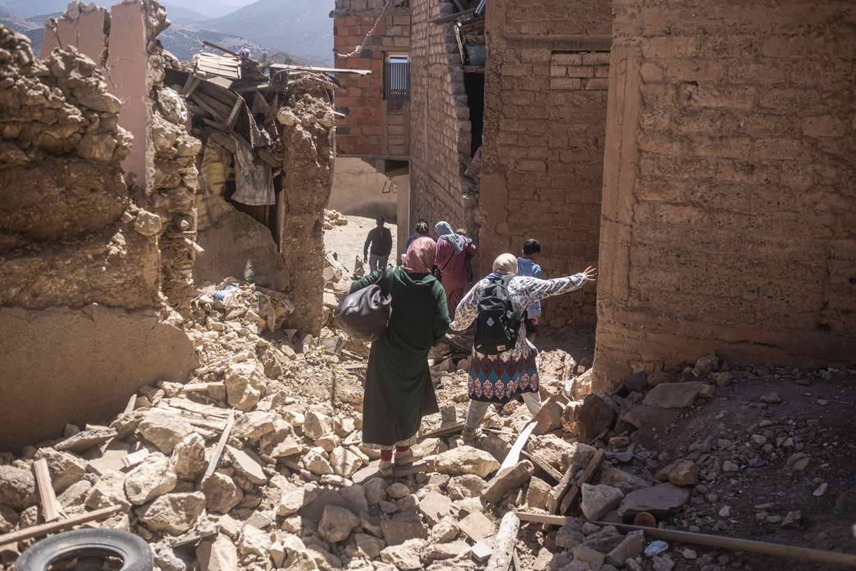 Residents flee their homes after an earthquake in Moulay Ibrahim village, near the epicenter of the earthquake, outside Marrakech, Morocco on Saturday.