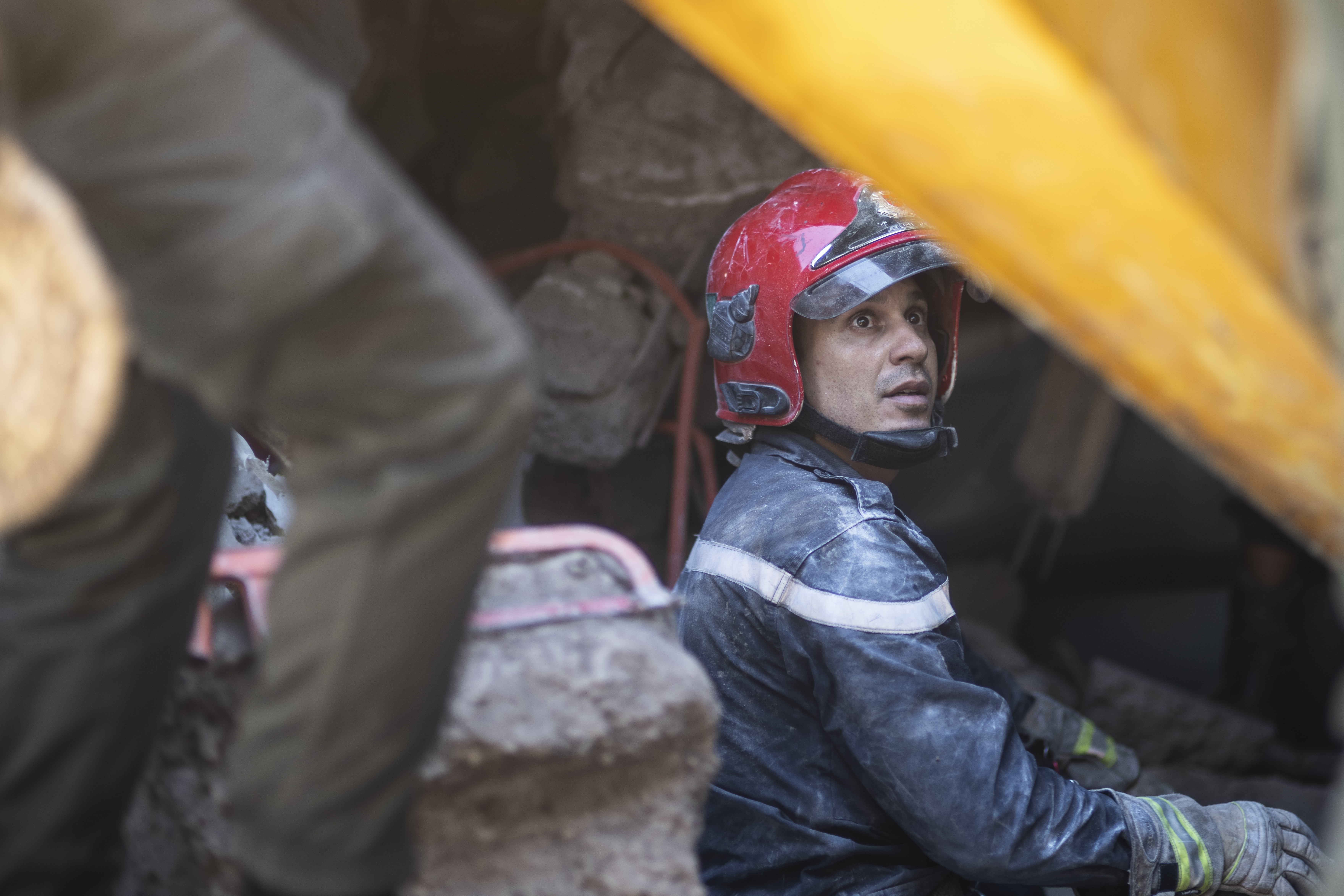 A rescue workers pauses while taking part in a rescue operation after the earthquake, in Moulay Ibrahim village, near Marrakech, Morocco on Saturday.