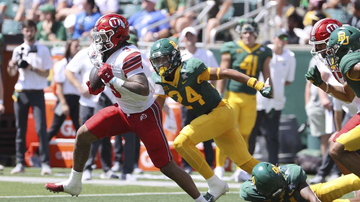 Utah running back Ja'Quinden Jackson (3) runs through the Baylor defense in the first half of an NCAA college football game, Saturday, Sept. 9, 2023, in Waco, Texas.