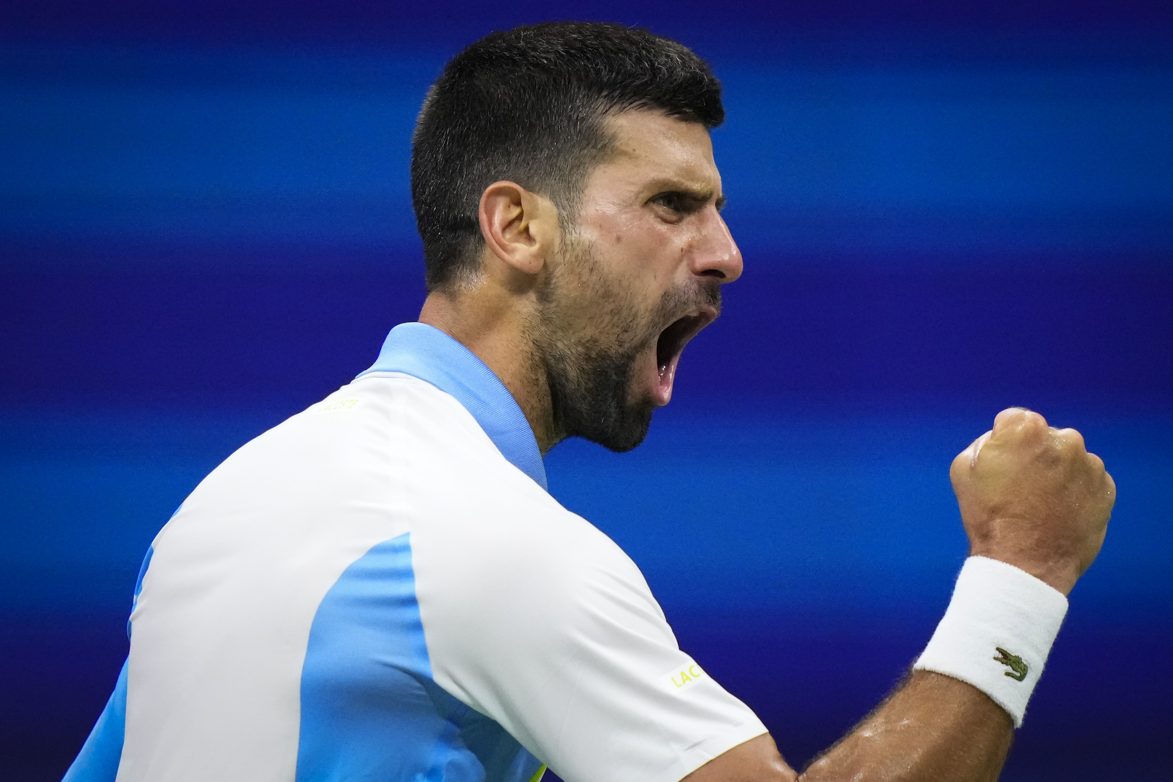 Novak Djokovic, of Serbia, reacts during a match against Ben Shelton, of the United States, during the men's singles semifinals of the U.S. Open tennis championships, Friday, Sept. 8, 2023, in New York. 