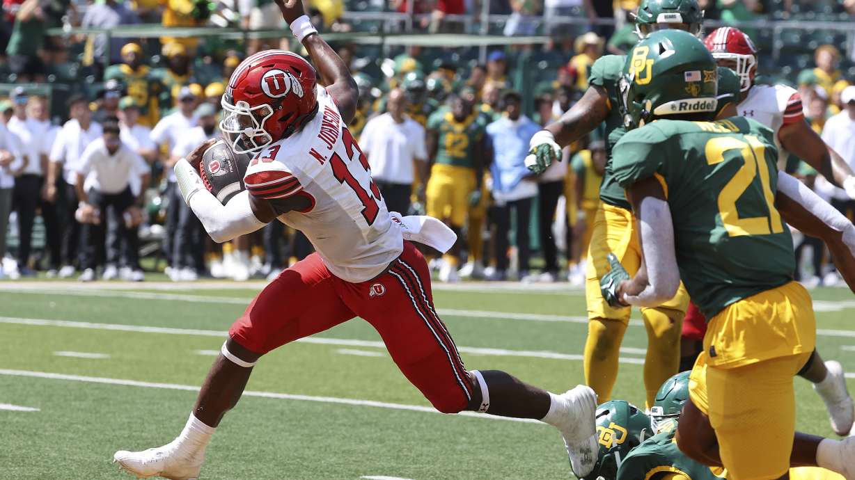 Utah quarterback Nate Johnson (13) scores a touchdown against Baylor in the second half of an NCAA college football game, Saturday, Sept. 9, 2023, in Waco, Texas.
