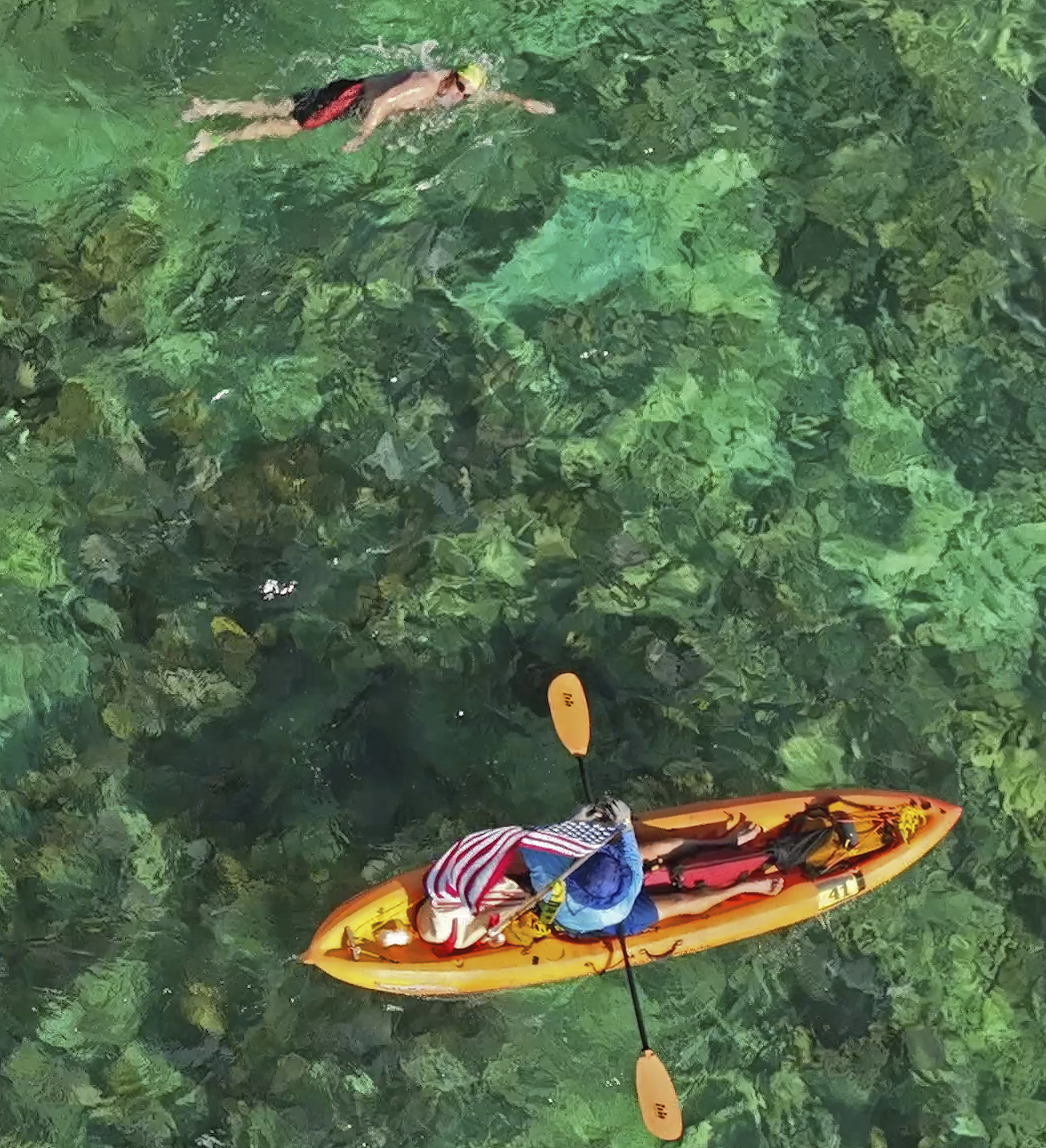 In this photo provided by the Florida Keys News Bureau, a swimmer escorted by a kayaker, competes in the Swim for Alligator Lighthouse open-water challenge Saturday, Sept. 9, 2023, off Islamorada, Fla., in the Florida Keys. The 8-mile roundtrip race attracted almost 400 swimmers divided into categories including solo and two-, three- and four-person relay teams. The annual event helps raise funds to restore Alligator Reef Lighthouse, one of six aging Florida Keys lighthouses, that are some 150 years old and no longer needed for navigation. The beacon is named for the USS Alligator, a U.S. Navy schooner that ran aground and sank on the reef in 1822. 