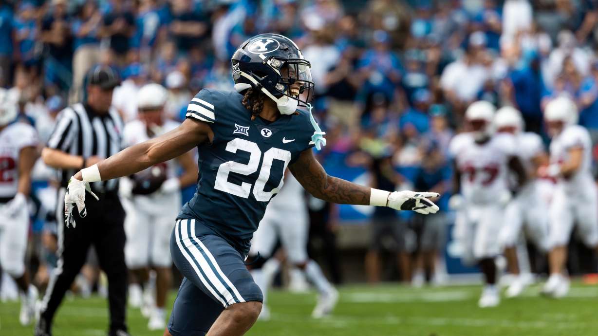 Brigham Young running back Deion Smith (20)celebrates his touchdown at the end of the first half at LaVell Edwards Stadium in Provo on Saturday, Sept. 9, 2023.
