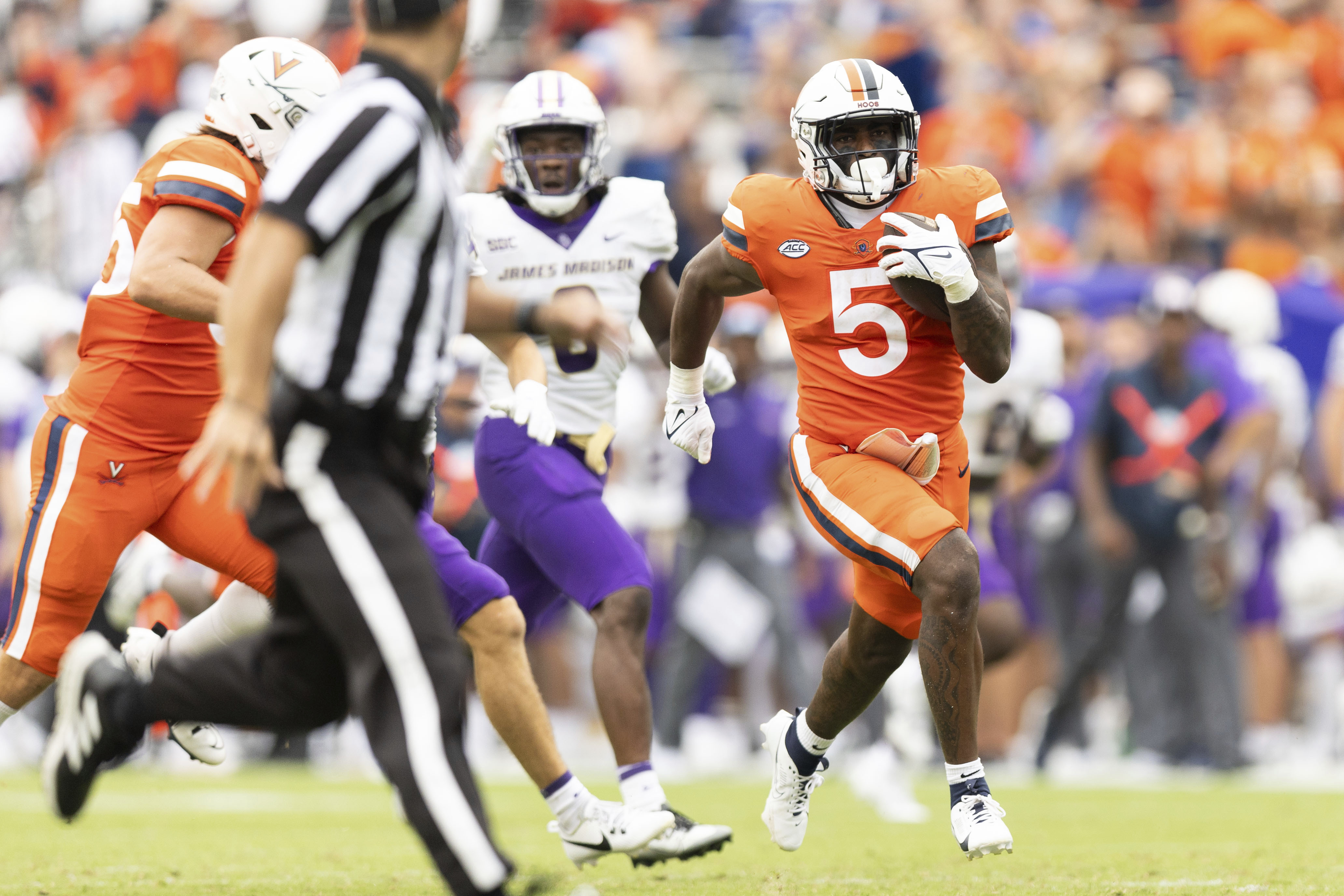 Virginia's Kobe Pace (5) drives with the ball during an NCAA college football game against James Madison in Charlottesville, Va., on Saturday, Sept. 9, 2023. 