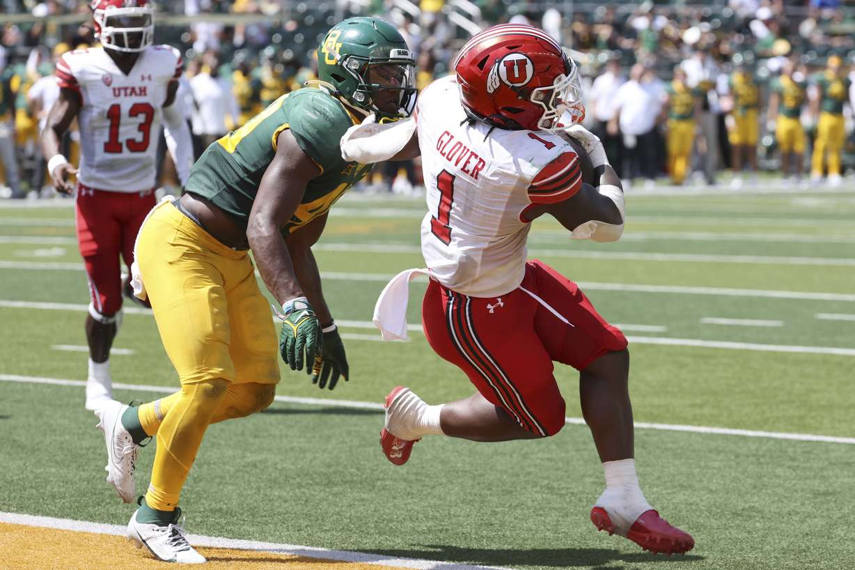 Utah running back Jaylon Glover scores a touchdown past Baylor linebacker Brooks Miller in the second half of an NCAA college football game, Saturday, Sept. 9, 2023, in Waco, Texas.