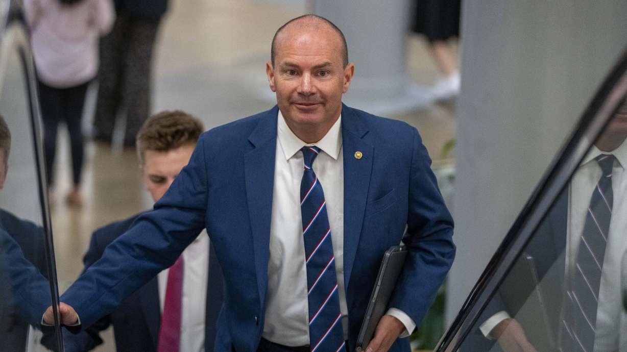 Sen. Mike Lee, R-Utah, heads to a vote on Capitol Hill on Wednesday in Washington. The deficit for fiscal year 2023 is expected to rise to over $2 trillion. Lee called the jump "unprecedented."