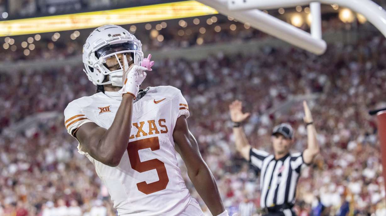 Texas wide receiver Adonai Mitchell (5) gestures to the crowd after a touchdown against Alabama during the second half of an NCAA college football game Saturday, Sept. 9, 2023, in Tuscaloosa, Ala.
