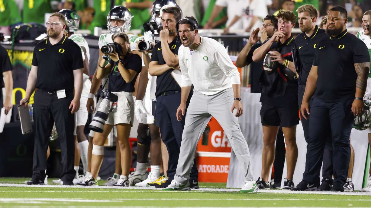 Oregon head coach Dan Lanning shouts to players during the second half half of the team's NCAA college football game against Texas Tech, Saturday, Sept. 9, 2023, in Lubbock, Texas.
