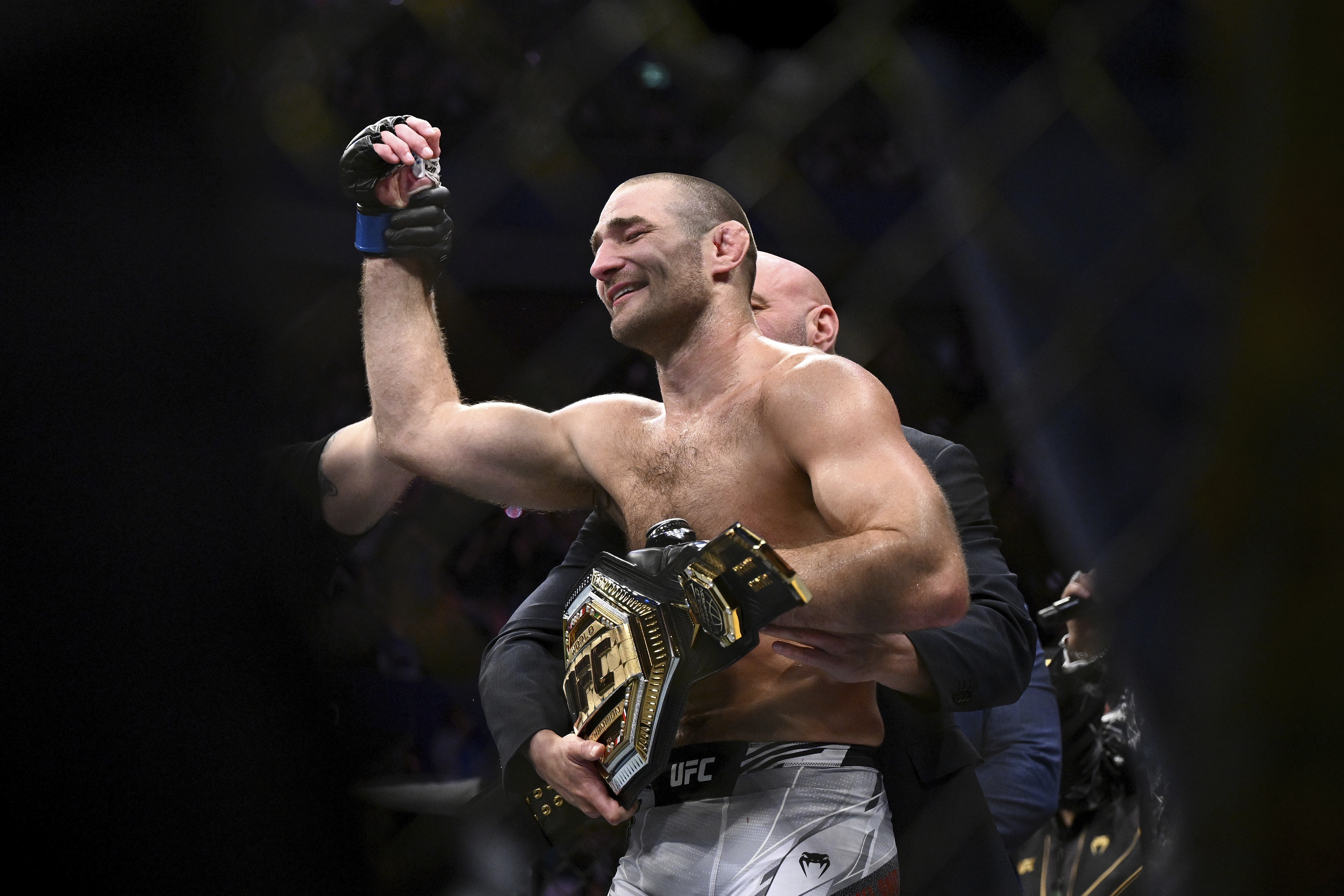 American Sean Strickland celebrates defeating Nigerian-born New Zealander Israel Adesanya to claim the middleweight title by unanimous decision in the main event of UFC 293 in Sydney, Sunday, Sept. 10, 2023.