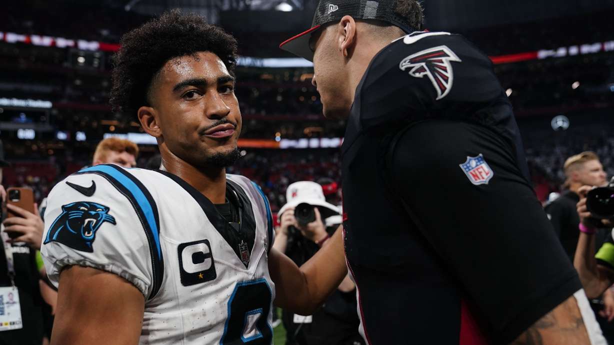 Carolina Panthers quarterback Bryce Young (9) speaks with Atlanta Falcons quarterback Desmond Ridder (9) after an NFL football game, Sunday, Sept. 10, 2023, in Atlanta. The Atlanta Falcons won 24-10.