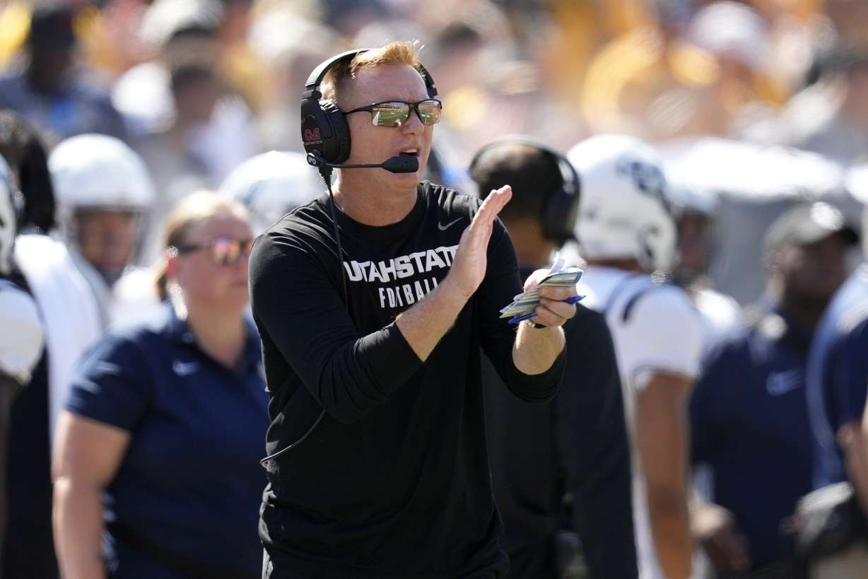 Utah State head coach Blake Anderson watches from the sideline during the first half of an NCAA college football game against Iowa, Saturday, Sept. 2, 2023, in Iowa City, Iowa.