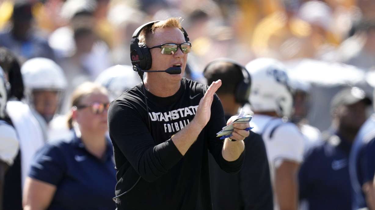 Utah State head coach Blake Anderson watches from the sideline during the first half of an NCAA college football game against Iowa, Saturday, Sept. 2, 2023, in Iowa City, Iowa.
