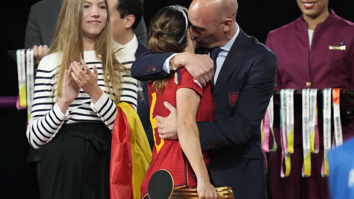 FILE - President of Spain's soccer federation, Luis Rubiales, right, hugs Spain's Aitana Bonmati on the podium following Spain's win in the final of Women's World Cup soccer against England at Stadium Australia in Sydney, Australia, Sunday, Aug. 20, 2023. Rubiales has resigned, Sunday, Sept. 10, 2023, from his post after a kiss scandal which tarnished Spain's victory at the Women's World Cup.