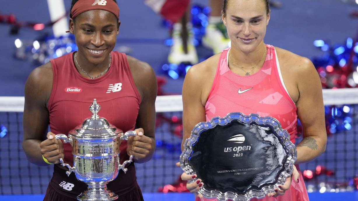 Coco Gauff, left, of the United States, poses for photographs with Aryna Sabalenka, of Belarus, at the women's singles final of the U.S. Open tennis championships, Saturday, Sept. 9, 2023, in New York.