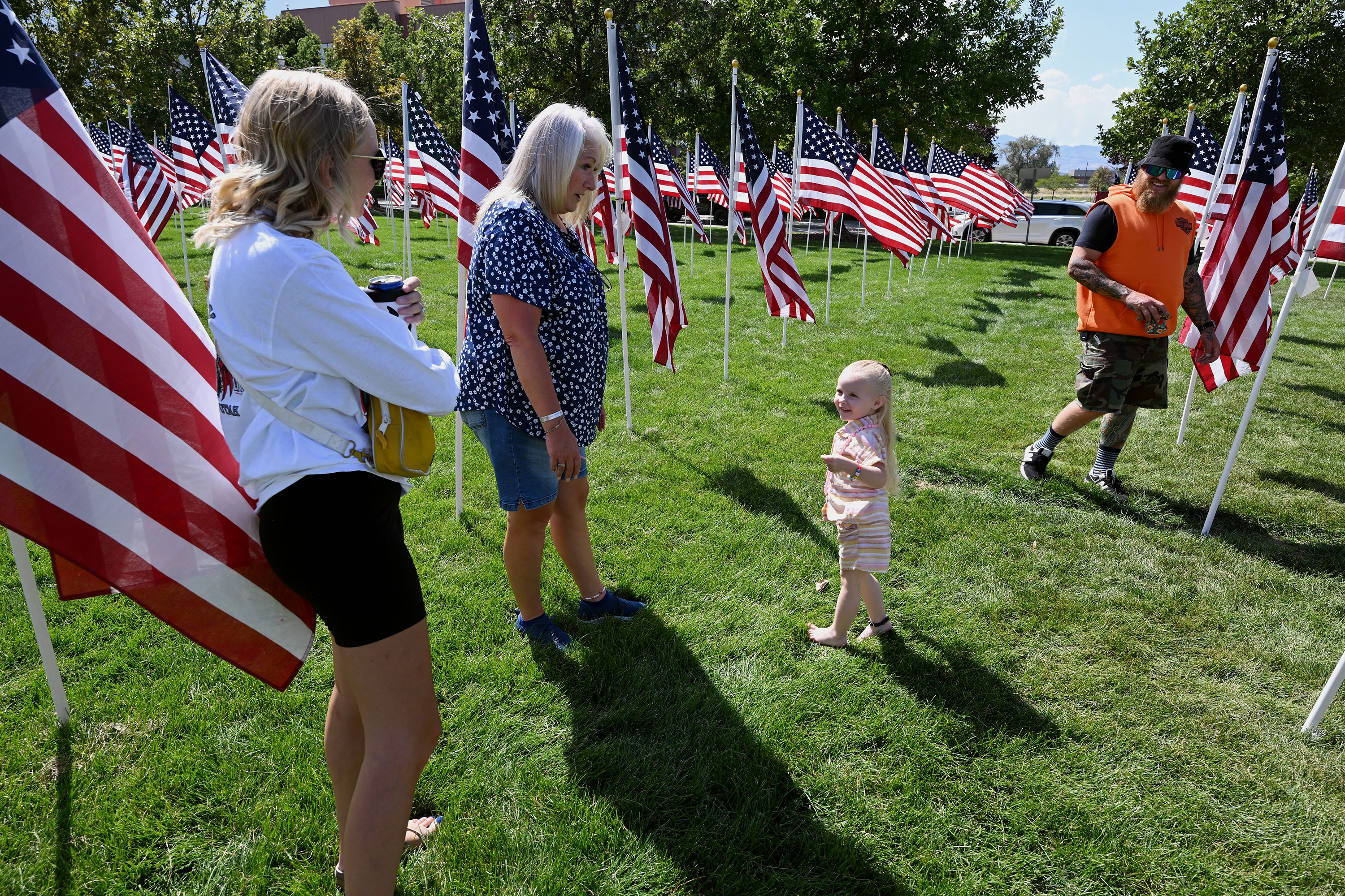 Addyson Silva, Thane Peck, Aubree Silva and Cary Fry walk around the Sandy 9/11 Healing Field on Sunday.