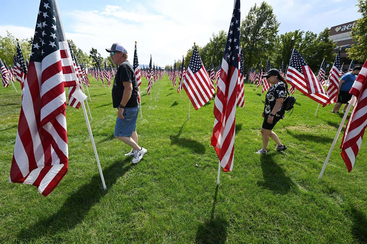 Rob and Henrietta Christensen walk in the Sandy 9/11 Healing Field on Sunday.