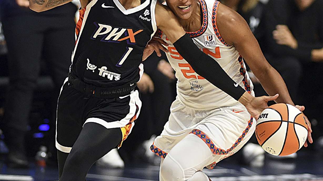 Phoenix Mercury's Sug Sutton (1) steals a ball from Connecticut Sun's Alyssa Thomas (25) during a WNBA basketball game in Uncasville, Conn., Thursday, Aug. 31, 2023.
