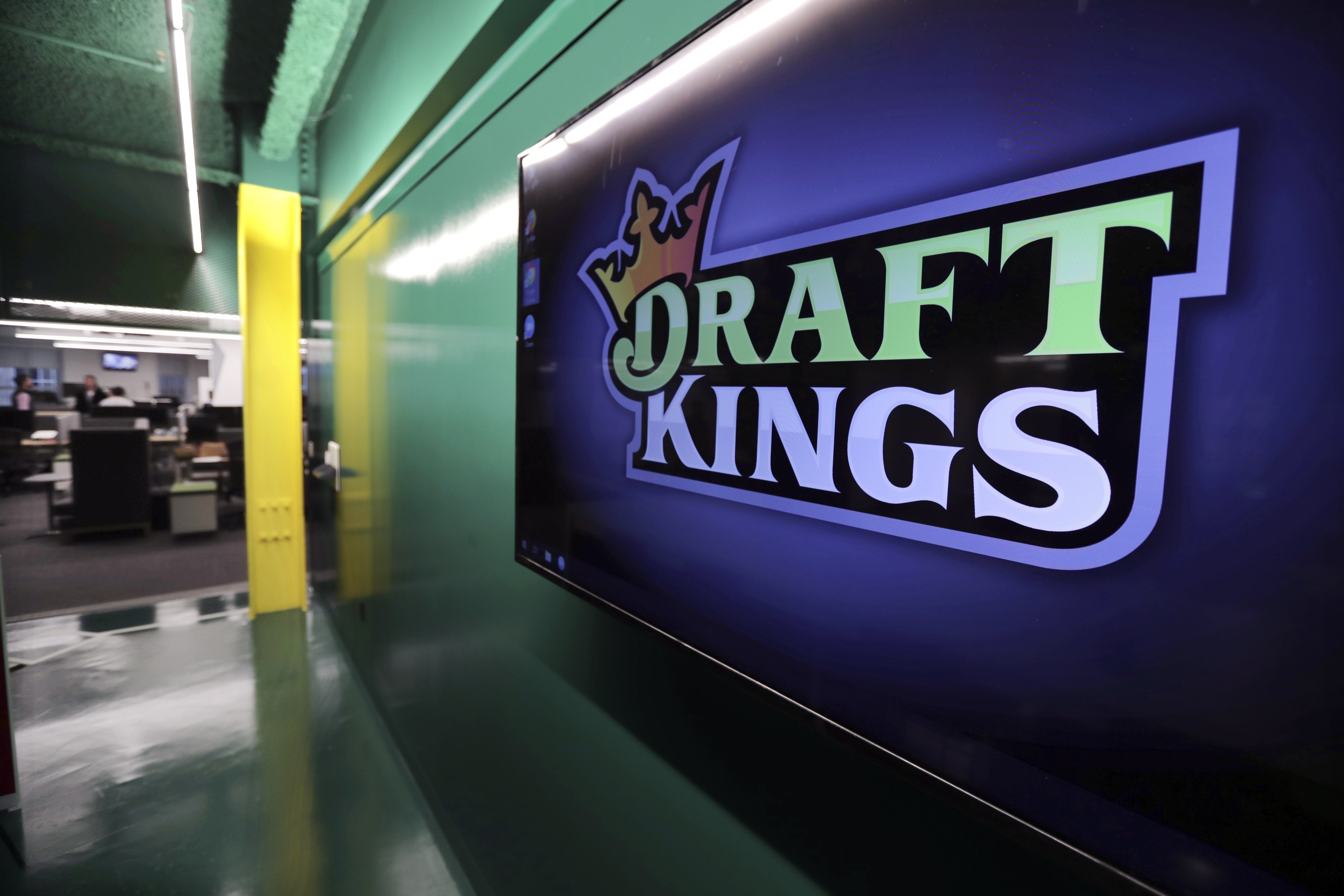 FILE - The DraftKings logo is displayed at the sports betting company headquarters, May 2, 2019, in Boston. DraftKings apologized Monday, Sept. 11, 2023, after using the Sept. 11, 2001, terror attacks to entice people to bet on baseball and football games on the anniversary of the tragedy that killed nearly 3,000 people. 