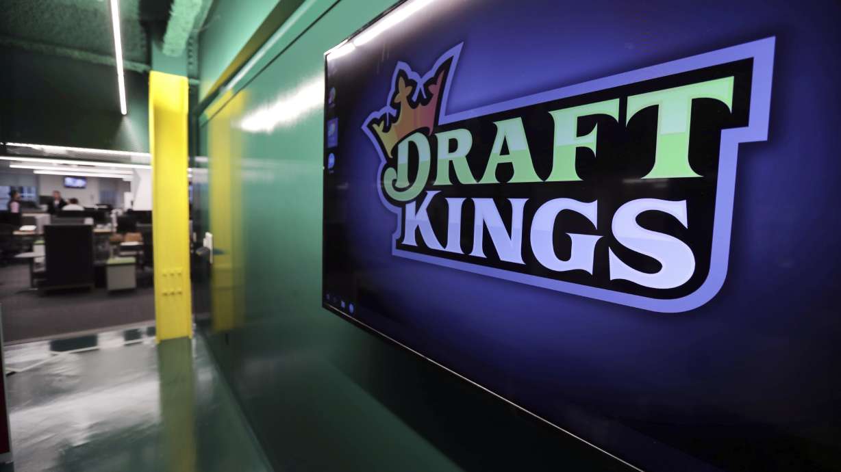 FILE - The DraftKings logo is displayed at the sports betting company headquarters, May 2, 2019, in Boston. DraftKings apologized Monday, Sept. 11, 2023, after using the Sept. 11, 2001, terror attacks to entice people to bet on baseball and football games on the anniversary of the tragedy that killed nearly 3,000 people.