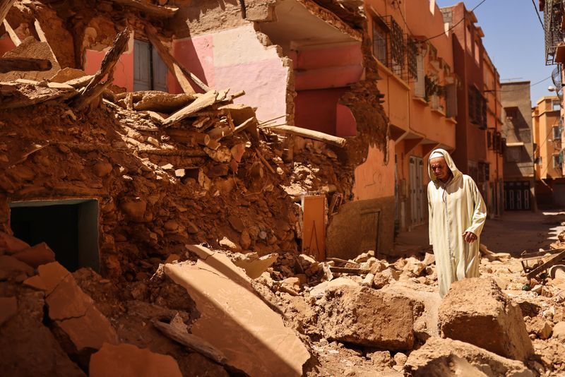 Mohamed Sebbagh, 66, stands in front of his destroyed house, in the aftermath of a deadly earthquake, in Amizmiz, Morocco, Sunday.