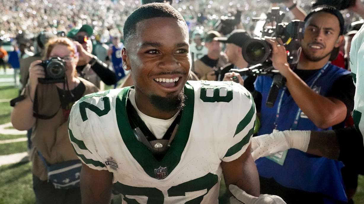 New York Jets wide receiver Xavier Gipson (82) celebrates after running a punt return back for a touchdown against the Buffalo Bills in overtime of an NFL football game, Monday, Sept. 11, 2023, in East Rutherford, N.J.