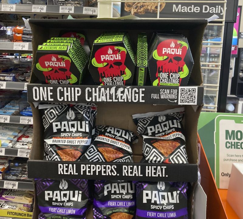 Paqui One Chip Challenge chips are displayed at a 7-Eleven store in Boston, Sept. 7. The death of a Massachusetts teenager after his family said he ate an extremely spicy tortilla chip has led to an outpouring of concern about the social media challenge and prompted retailers to pull the product from their shelves at the manufacturer's request. The chips were removed from display on Sept. 8.