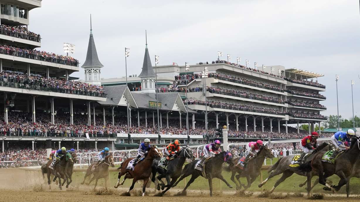 FILE - Javier Castellano, atop Mage, third from left, is seen with others behind the pack as they make the first turn while competing in the 149th running of the Kentucky Derby horse race at Churchill Downs Saturday, May 6, 2023, in Louisville, Ky. Horse racing's federally created oversight panel found no single cause of death among 12 horses at Churchill Downs this spring, but recommends further action and analysis to mitigate risk at the home of the Kentucky Derby, according to a report released Tuesday, Sept. 12.