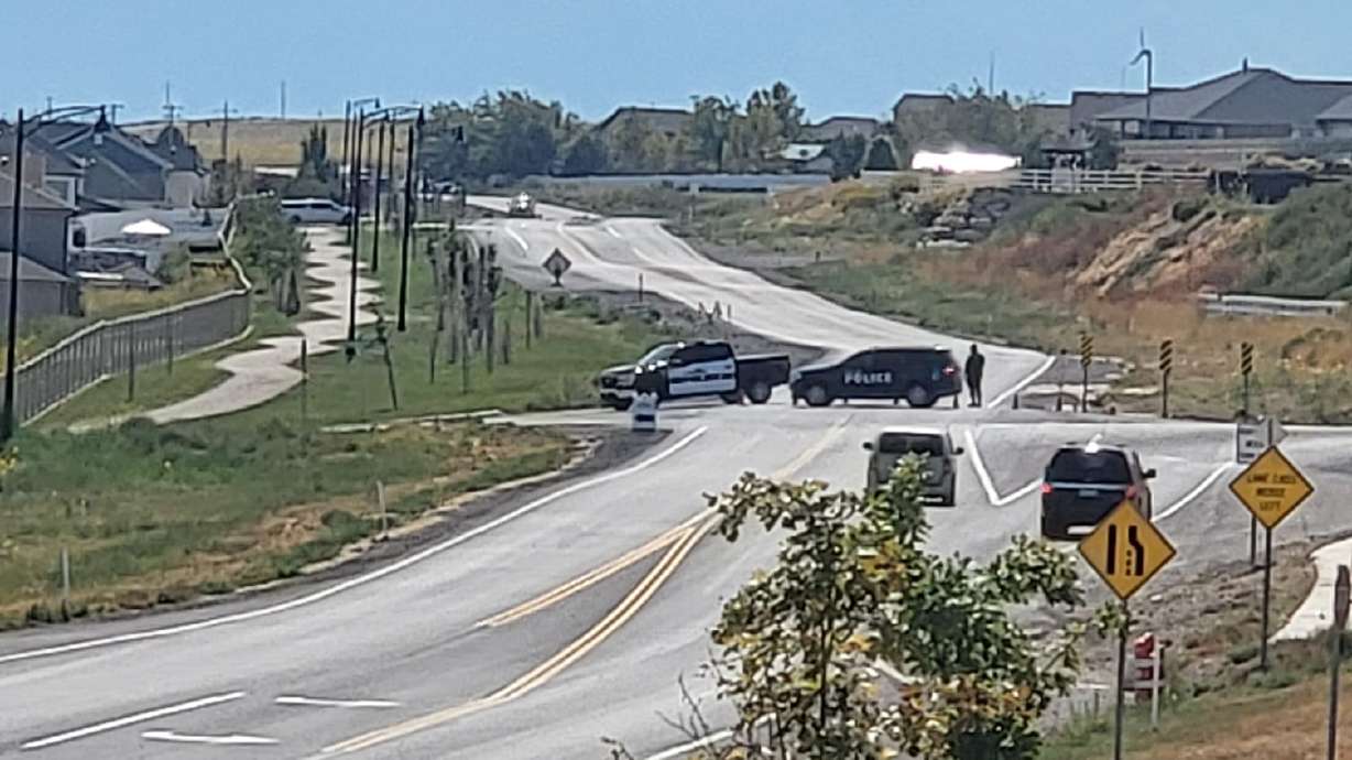 A cyclist was killed when she was hit by a semitruck on Redwood Road in Saratoga Springs on Tuesday, according to police.