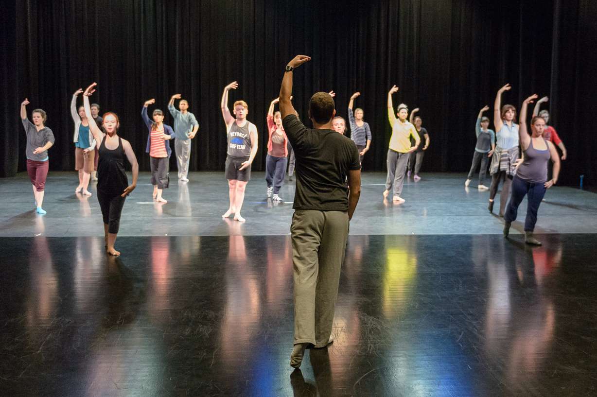 Artistic director Daniel Charon leads Ririe-Woodbury Company dancers in a warm up.