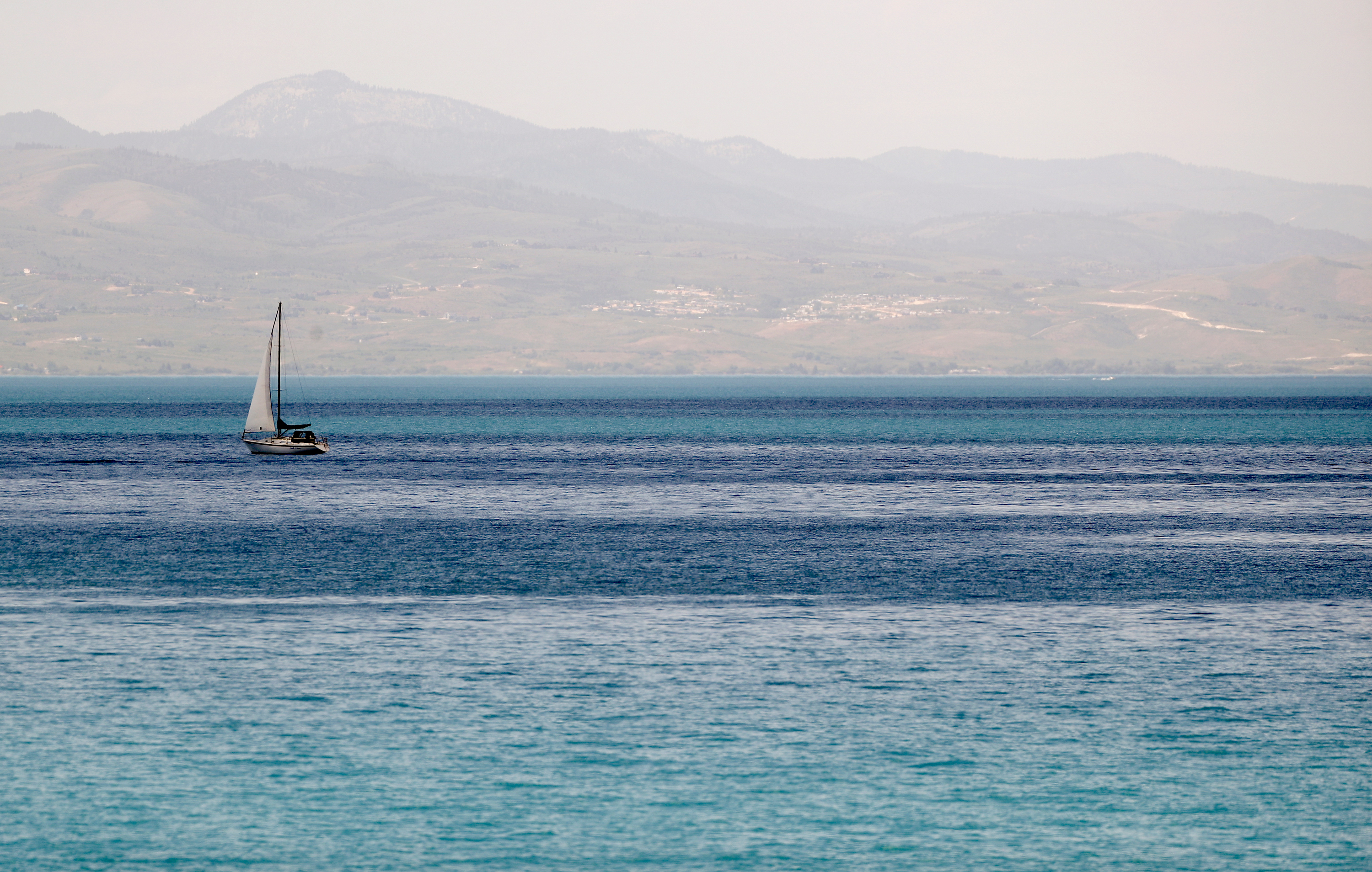 A sailboat on Bear Lake on June 29, 2022. Utah may consider a bill next year that seeks to protect and preserve the lake.