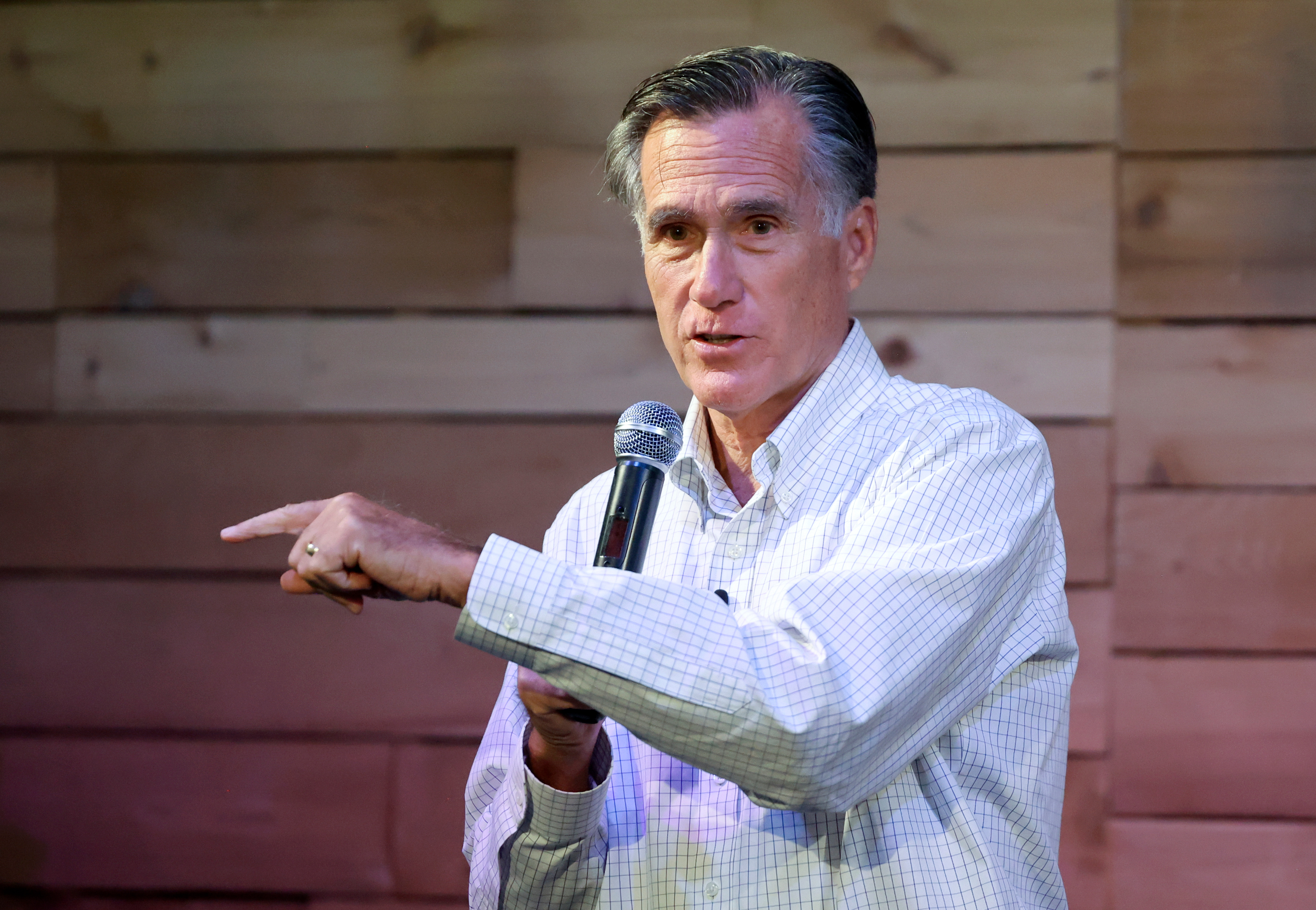 Sen. Mitt Romney, R-Utah, speaks in Provo Aug. 23. On Wednesday, Romney reintroduced legislation to gradually raise the federal minimum wage and mandate employers use E-Verify.