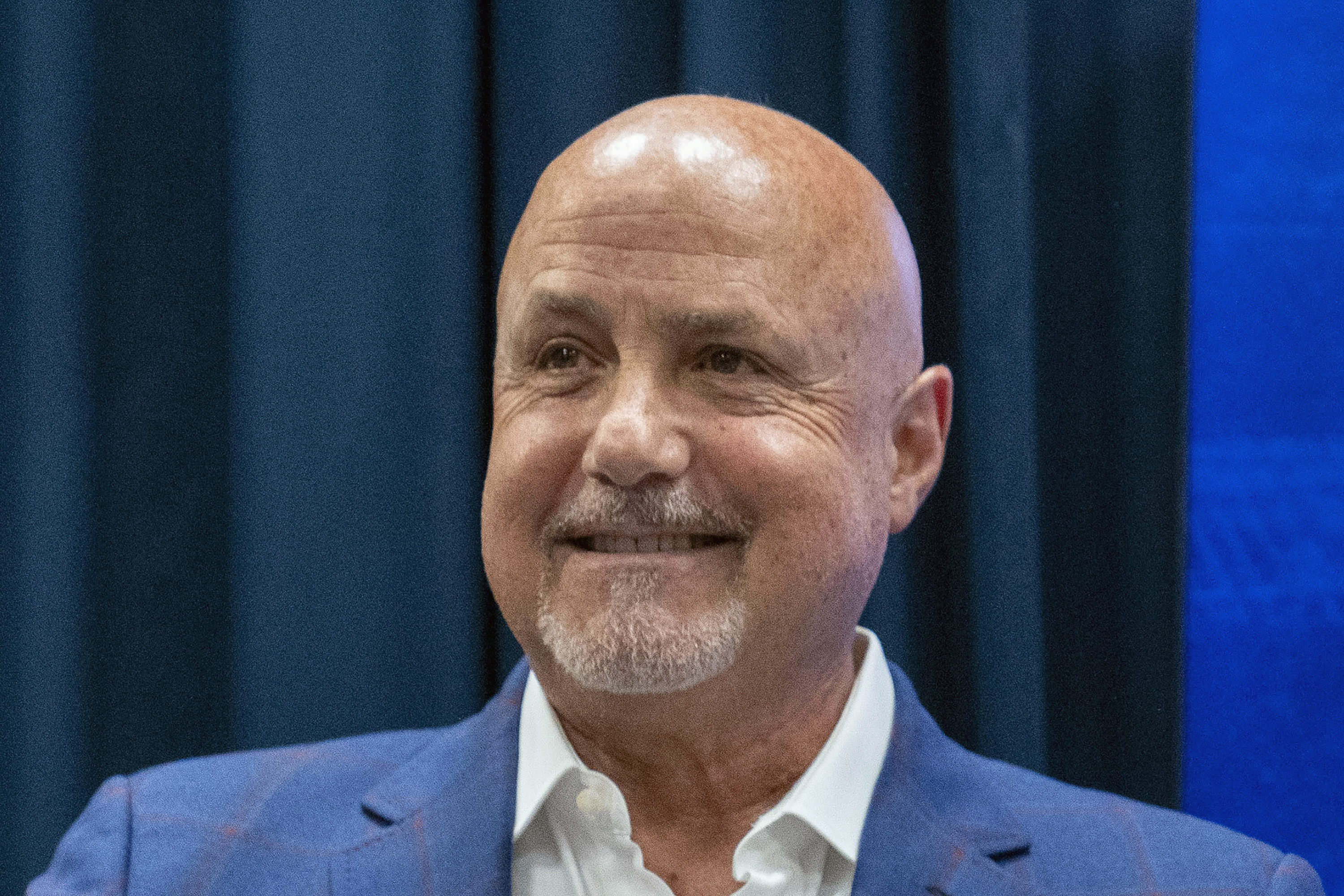 FILE - Washington Nationals general manager Mike Rizzo smiles during a media availability at Nationals Park, Saturday, July 22, 2023, in Washington. The Nationals are giving longtime president of baseball operations and general manager Mike Rizzo a chance to finish what he started. The club signed Rizzo to a multi-year extension on Wednesday, Sept. 13. 